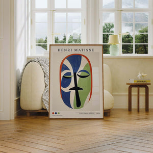 Plakat med farverigt stiliseret ansigt inspireret af Henri Matisse i blå og grønne former