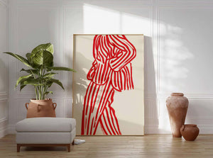 Rød figurplakat med organiske linjer og grafisk balance på lys baggrund i træramme