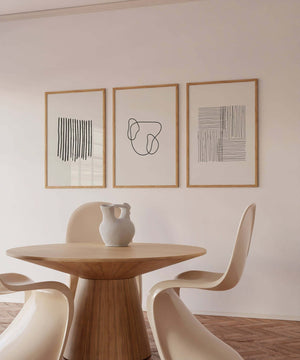 Minimalistisk billedvæg med tre moderne line art plakater i sort og hvid