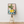 Citron plakat med stilleben motiv af citroner på tallerken og grøn plante