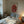 Katachi plakat med keramisk form i røde og sorte nuancer i egetræsramme over seng